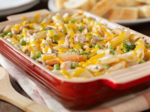 A pan of chicken casserole made with noodles and veggies.
