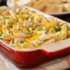 A pan of chicken casserole made with noodles and veggies.