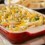 A pan of chicken casserole made with noodles and veggies.