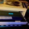 Thin books in file folders.