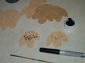 Writing Fall on the paper leaves and applying the dots.