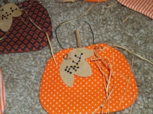 Finished pumpkin with raffia attached to wire.