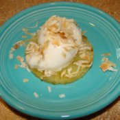 Grilled pineapple topped with coconut sorbet and toasted coconut.