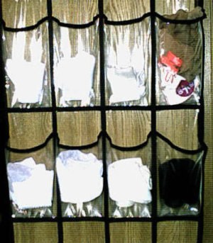 Organizing socks with an over the door shoe organizer.