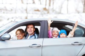 Family in Car Leaving in Winter