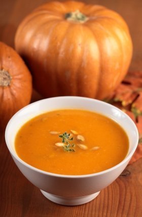 Pumpkin Soup with Pumpkins in the Background
