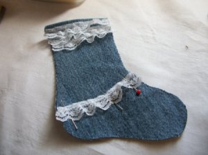 Half of stocking with lace at top and across the instep.