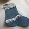 Half of stocking with lace at top and across the instep.