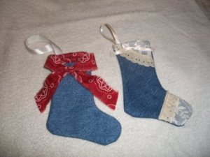 Two completed stockings, one with lace and one with bandana fabric.