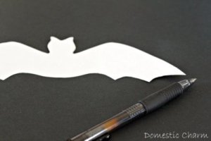 Bat template on black paper.