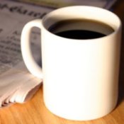 Hot coffee mug on wood table.