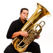 A man playing a tuba.