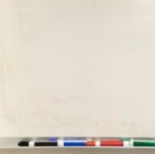 A dry erase board and markers.