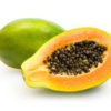 Whole papaya and cut half with black seeds