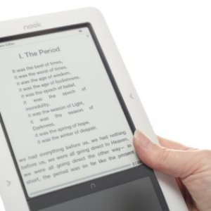 A person holding a Nook reader.