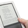 A person holding a Nook reader.