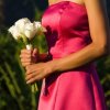 A woman wearing a homemade bridesmaid dress.
