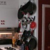 Pots, pans and lids
hanging on the pegboard in kitchen.