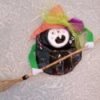 Happy witch with orange hat.