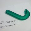 A green J-Popper kitchen tool for opening ring top cans.
