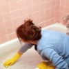 Woman Cleaning Bathtub
