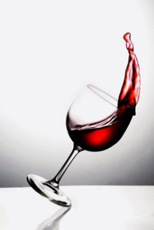 Red Wine Spilling Out of Glass