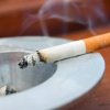 Removing a Cigarette Burn from Carpet, Cigarette resting on an ash tray.