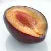 Half of plum on white plate