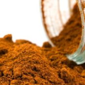 Paprika spilling out of a spice jar.