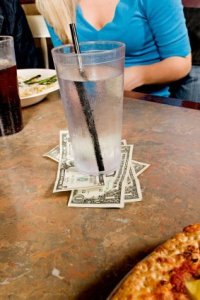Cash Tip Left UNder Water Glass at Pizza Restaurant