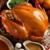 Large Turkey and Side Dishes at Thanksgiving Dinner Table
