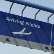 An arrival sign at an airport.