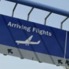 An arrival sign at an airport.