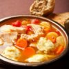 Turkey dumpling soup with carrots.