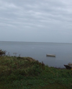 Lone Boat Sitting Just off Shore