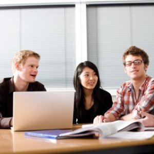 Money Saving Tips for College Students, Students studying at a table.