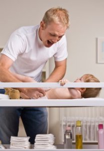 Father Changing a Baby's Diaper