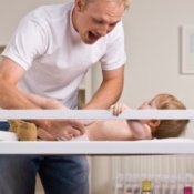 Father Changing a Baby's Diaper