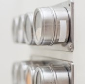 Spice rack with magnetic canisters.