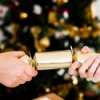 Homemade Christmas Crackers, Two people pulling apart a Christmas cracker.