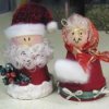 Clay pot Santa and Mrs. Claus.