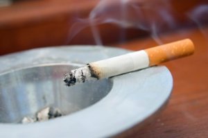 Cigarette Left Burning in Ashtray