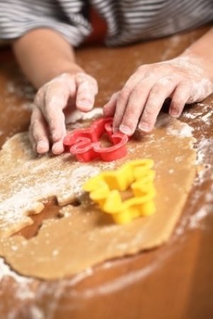 Plastic cookie cutters in use.