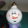 Uses for Light Bulbs (Incandescent), A recycled vanity lightbulb with a snowman face painted on it.