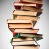 Getting Cigarette Smell Out of Books. A pile of old books.