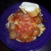 A plate of spaghetti and meatballs.