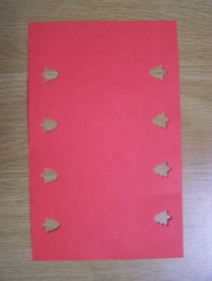 Red Paper with tree shaped hole punches