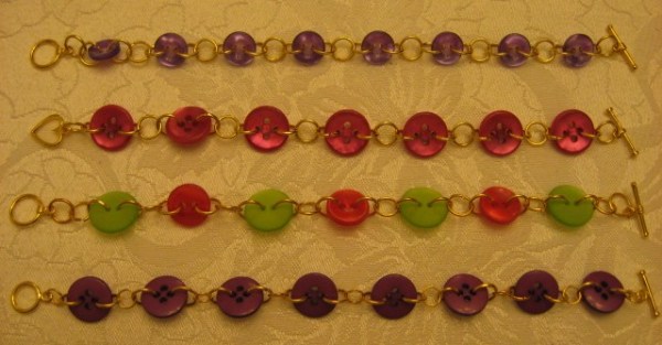 Four finished bracelets of varying colors.