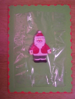 Use the sellotape to stick the plastic bag in place over the Christmas ornament.