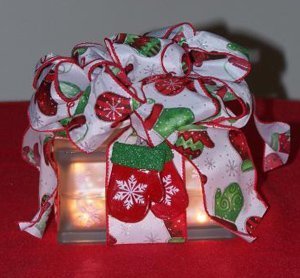 Glass block gift wrapped as a package.